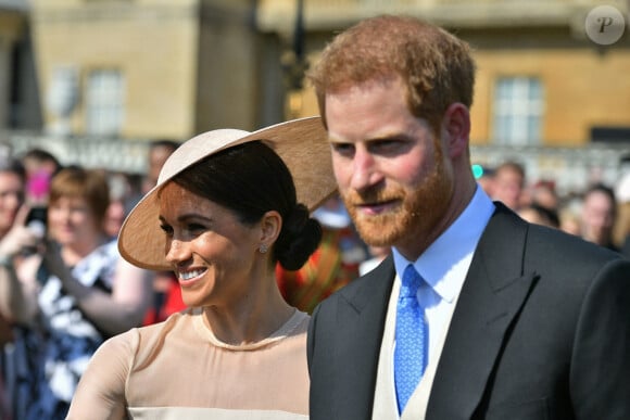 Le prince Harry, duc de Sussex, et Meghan Markle, duchesse de Sussex, lors de la garden party pour les 70 ans du prince Charles au palais de Buckingham à Londres. Le 22 mai 2018