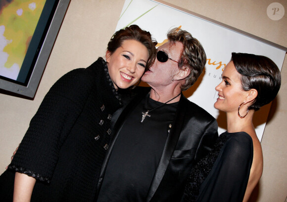 Johnny Hallyday, son épouse Laeticia et sa fille Laura Smet à Paris en 2013.