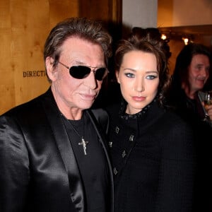 Johnny Hallyday et sa fille Laura Smet (alors âgée de 28 ans) lors d'une vente aux enchères à l'Hôtel des ventes Drouot, à Paris.