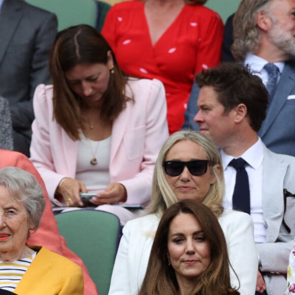 Kate Middleton, duchesse de Cambridge, et son mari le prince William, duc de Cambridge, assistent à la finale simple dames de Wimbledon opposant l'Australienne Ashleigh Barty à la Tchèque Karolína Plíšková. Londres, le 10 juillet 2021.