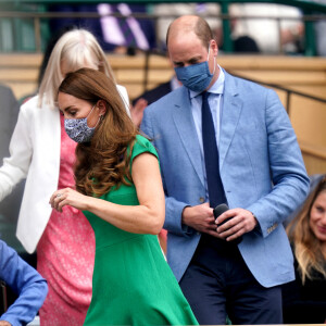 Kate Middleton, duchesse de Cambridge, et son mari le prince William, duc de Cambridge, assistent à la finale simple dames de Wimbledon opposant l'Australienne Ashleigh Barty à la Tchèque Karolína Plíšková. Londres, le 10 juillet 2021.