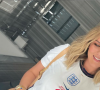 Kate Kane, l'épouse du footballeur Harry Kane, porte le maillot de l'équipe d'Angleterre à l'Euro 2020. Juillet 2021.