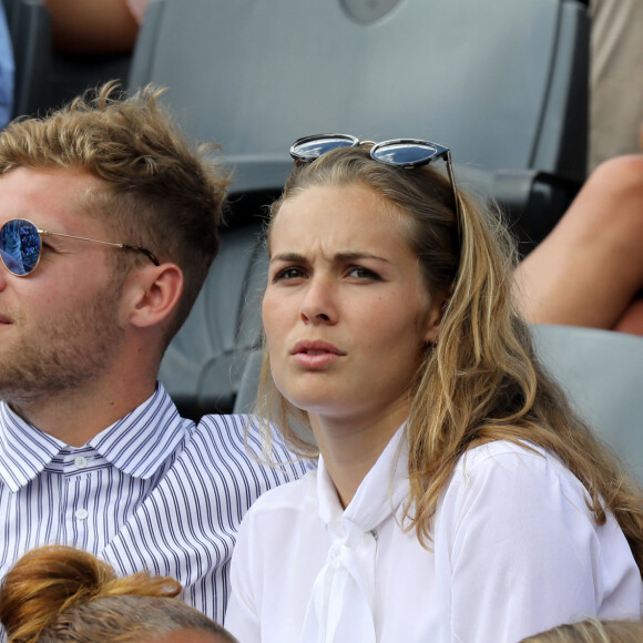 Kevin Mayer et sa compagne Delphine Jariel dans les tribunes des Internationaux de France de Tennis de Roland Garros à Paris le 2 juin 2018. © Dominique Jacovides-Cyril Moreau / Bestimage