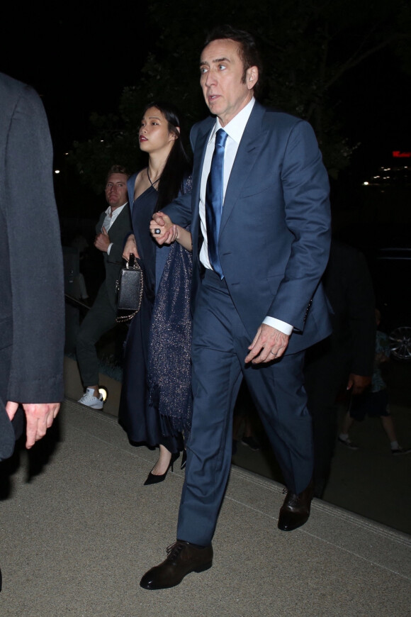 Exclusif - Nicolas Cage et sa femme Riko Shibata arrivent main dans la main à une fête à Los Angeles, le 13 juillet 2021.