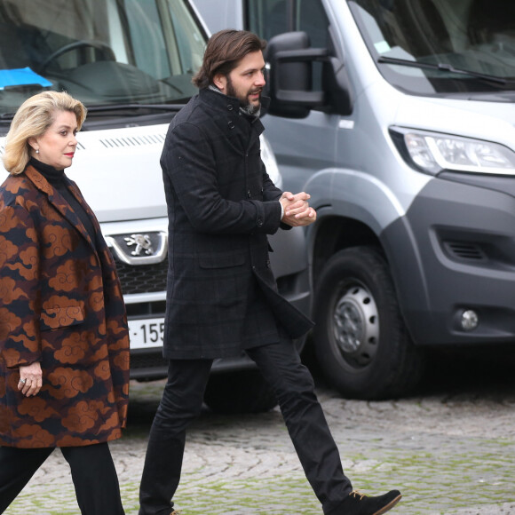 Alex Beaupain, Catherine Deneuve - Obsèques de Michel Delpech en l'église Saint-Sulpice à Paris, le 8 janvier 2016.