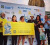 Marine Danaux, Grégory Montel et leur fils à Marseille pour soutenir le MC Swim Challenge, une compétition de nage au profit des enfants atteints de cancer.