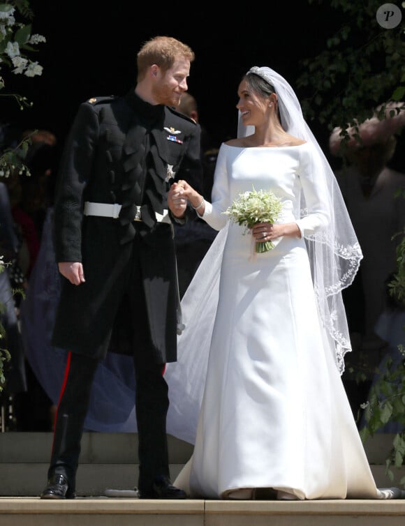 Le prince Harry, duc de Sussex, et Meghan Markle, duchesse de Sussex, à la sortie de chapelle St. George au château de Windsor - Sortie après la cérémonie de mariage du prince Harry et de Meghan Markle en la chapelle Saint-George au château de Windsor, Royaume Uni, le 19 mai 2018.