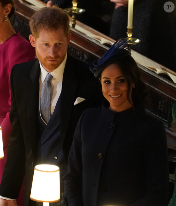 Le prince Harry, duc de Sussex, et Meghan Markle, duchesse de Sussex, à la cérémonie de mariage de la princesse Eugenie d'York et Jack Brooksbank en la chapelle Saint-George au château de Windsor, Royaume Uni le 12 octobre 2018.