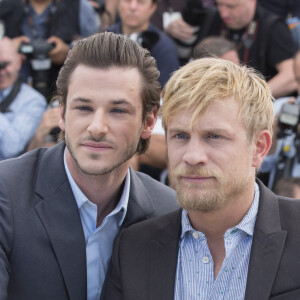 Gaspard Ulliel et Jérémie Renier - Photocall du film "Saint Laurent" lors du 67ème festival international du film de Cannes, le 17 mai 2014. 