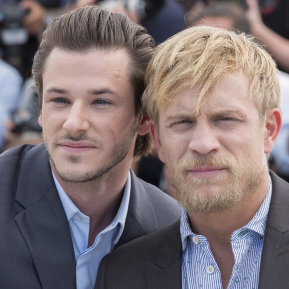 Gaspard Ulliel et Jérémie Renier - Photocall du film "Saint Laurent" lors du 67ème festival international du film de Cannes, le 17 mai 2014. 