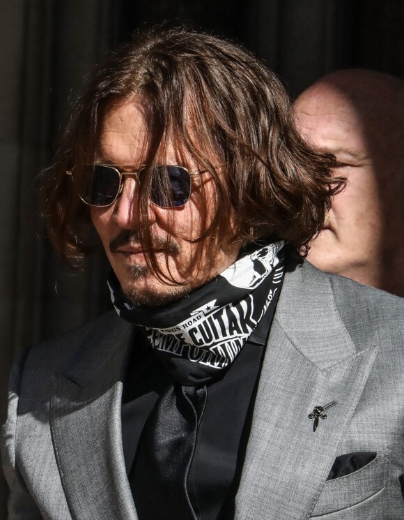 Johnny Depp la sortie de la cour royal de justice à Londres, pour le procès en diffamation contre le magazine The Sun Newspaper, le 28 juillet 2020 Il porte un masque obligatoire face à l'épidémie de Coronavirus (COVID-19). 
