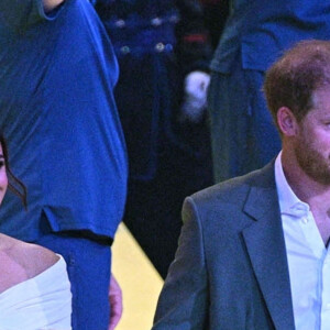 Le prince Harry et Meghan Markle lors de la cérémonie d'ouverture des Invictus Games 2020 à La Haye, le 16 avril 2022. 