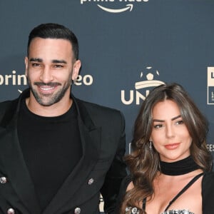 Adil Rami et sa compagne Léna Guillou - Photocall de la cérémonie des Trophées UNFP 2022 au Pavillon Gabriel à Paris le 15 mai 2022. © Coadic Guirec/Bestimage