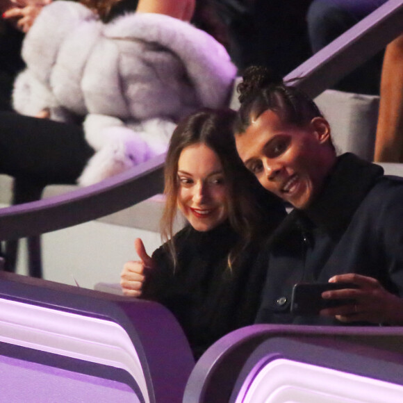 Stromae (nouvelle coupe de cheveux) et sa femme Coralie Barbier au défilé "Victoria's Secret Paris 2016" au Grand Palais à Paris, le 30 novembre 2016. © Denis Guignebourg/Bestimage 