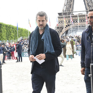 Guillaume Canet lors de la 8ème édition du "Longines Paris Eiffel Jumping" au Champ de Mars à Paris, le 25 juin 2022.