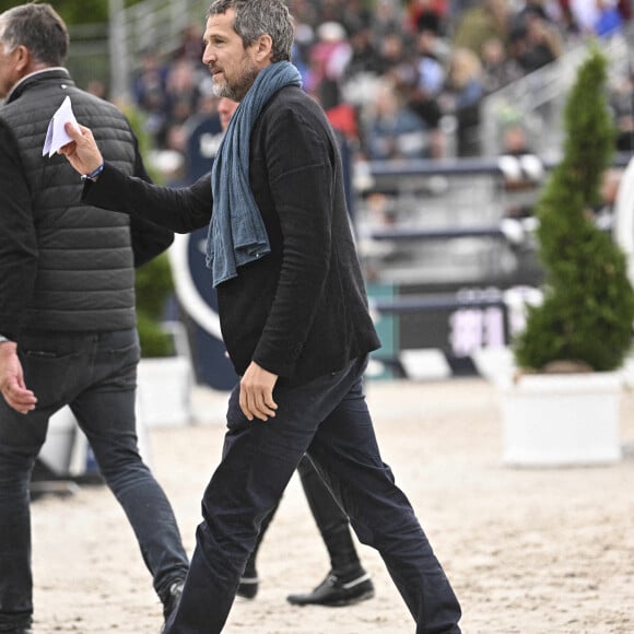 Guillaume Canet lors de la 8ème édition du "Longines Paris Eiffel Jumping" au Champ de Mars à Paris, le 25 juin 2022. 