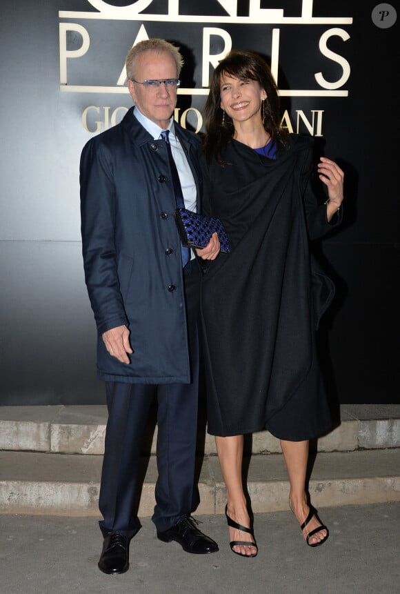 Sophie Marceau et son compagnon Christophe Lambert - Arrivee des people au defile Giorgio Armani Haute Couture Printemps/Ete au Palais de Tokyo à Paris. 