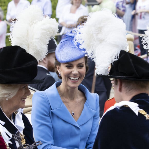 Le prince William, duc de Cambridge, et Catherine (Kate) Middleton, duchesse de Cambridge, le prince Charles, prince de Galles, et Camilla Parker Bowles, duchesse de Cornouailles, lors de la cérémonie de l'ordre de la Jarretière à la chapelle Saint-Georges du château de Windsor. Londres, la 13 juin 2022. 