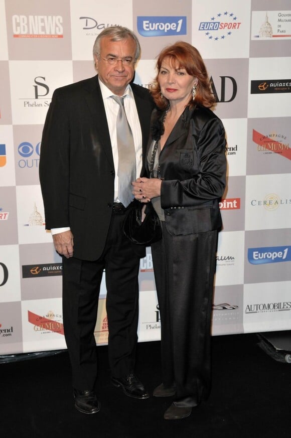 Jean-Claude Dassier et son épouse au 25e Festival International de l'Automobile. 04/02/2010