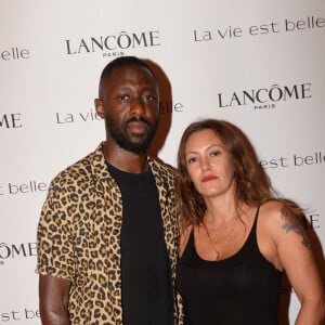 Thomas Ngijol et sa compagne Karole Rocher Soirée Lancôme pour célébrer la nouvelle communication du parfum Iconique "La Vie est Belle" à l'hôtel Mona Bismarck à Paris le 12 septembre 2018. © Rachid Bellak / Bestimage 