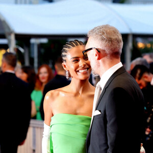 Tina Kunakey et son mari Vincent Cassel - Montée des marches du film " Les crimes du futur " lors du 75ème Festival International du Film de Cannes. Le 23 mai 2022 © Dominique Jacovides / Bestimage 