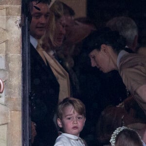 Le prince George de Cambridge, sa soeur Charlotte et la nounou Maria Borrallo - Mariage de P. Middleton et J. Matthew, en l'église St Mark Englefield, le 20 mai 2017.