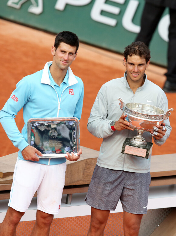 Novak Djokovic et Rafael Nadal - Rafael Nadal remporte la finale des Internationaux de France de tennis de Roland Garros à Paris le 8 juin 2014.