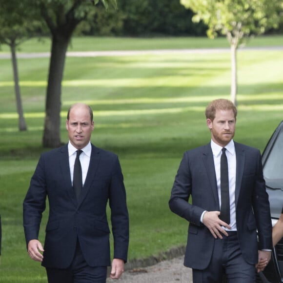 Catherine, Princess of Wales, Prince William, Prince of Wales, Prince Harry, Duke of Sussex, and Meghan, Duchess of Sussex on the long Walk at Windsor Castle arrive to view flowers and tributes to HM Queen Elizabeth on September 10, 2022 in Windsor, England. Crowds have gathered and tributes left at the gates of Windsor Castle to Queen Elizabeth II, who died at Balmoral Castle on 8 September, 2022.