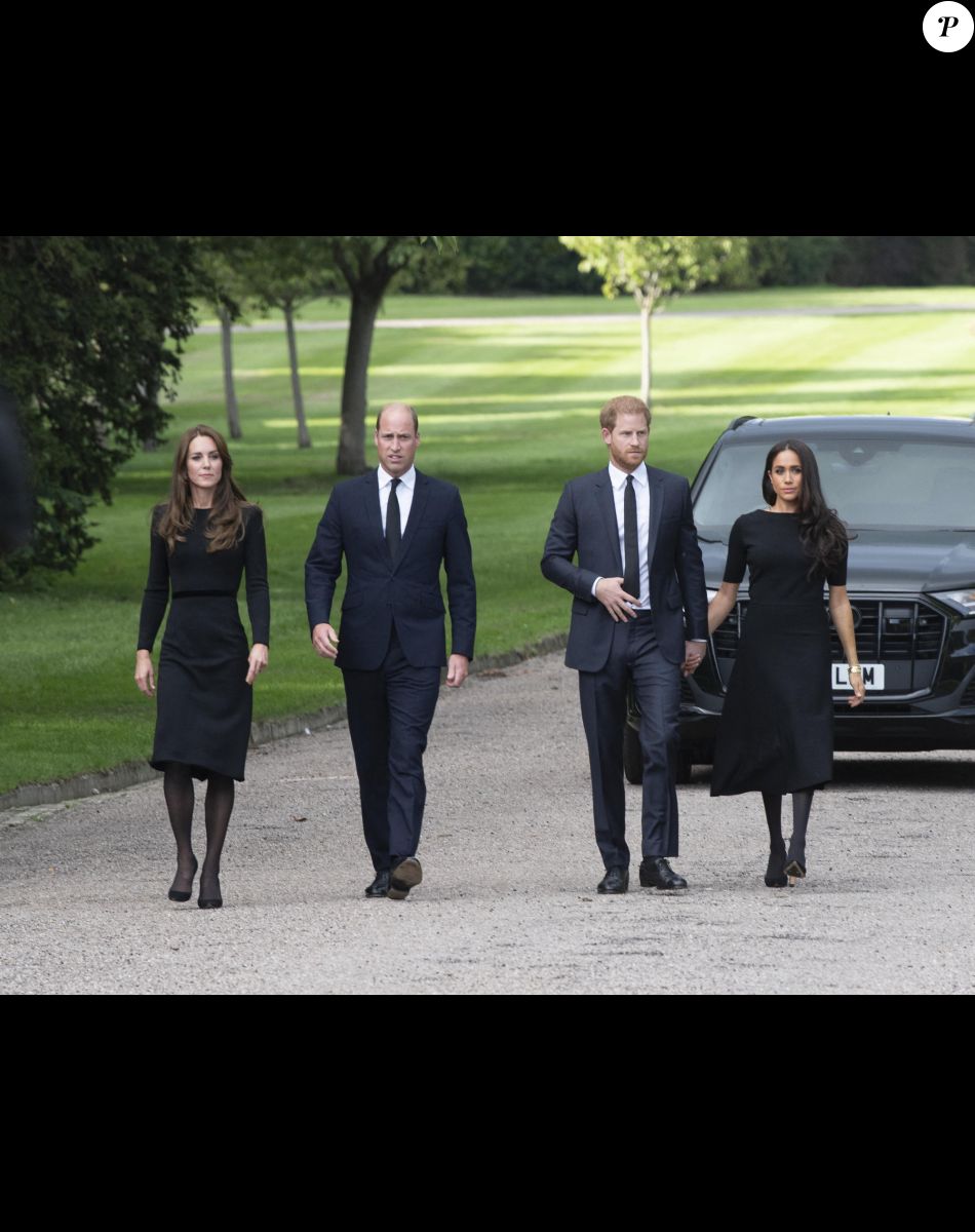 Catherine, Princess of Wales, Prince William, Prince of Wales, Prince Harry, Duke of Sussex, and Meghan, Duchess of Sussex on the long Walk at Windsor Castle arrive to view flowers and tributes to HM Queen Elizabeth on September 10, 2022 in Windsor, England. Crowds have gathered and tributes left at the gates of Windsor Castle to Queen Elizabeth II, who died at Balmoral Castle on 8 September, 2022.