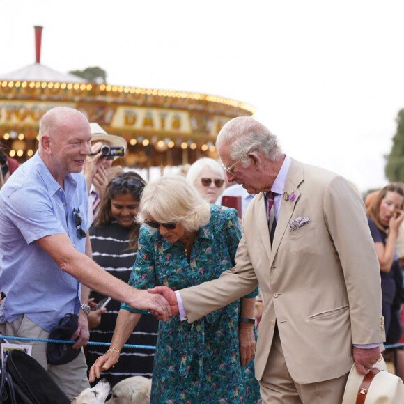 Le prince Charles, prince de Galles, et Camilla Parker Bowles, duchesse de Cornouailles, visitent l'exposition horticole "Sandringham Flower Show", le 27 juillet 2022. A cette occasion, le couple princier a rencontré des membres des forces armées. 