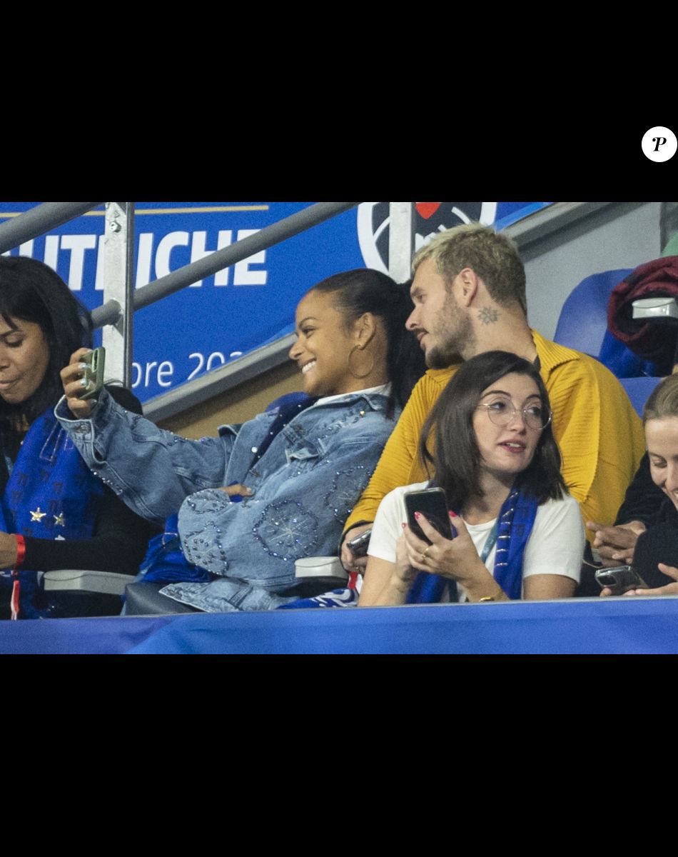 M. Pokora et sa femme Christina Milian - 5e et avant-dernière journée de la Ligue des nations entre la France et l'Autriche au Stade de France à Saint-Denis. Le 22 septembre 2022.