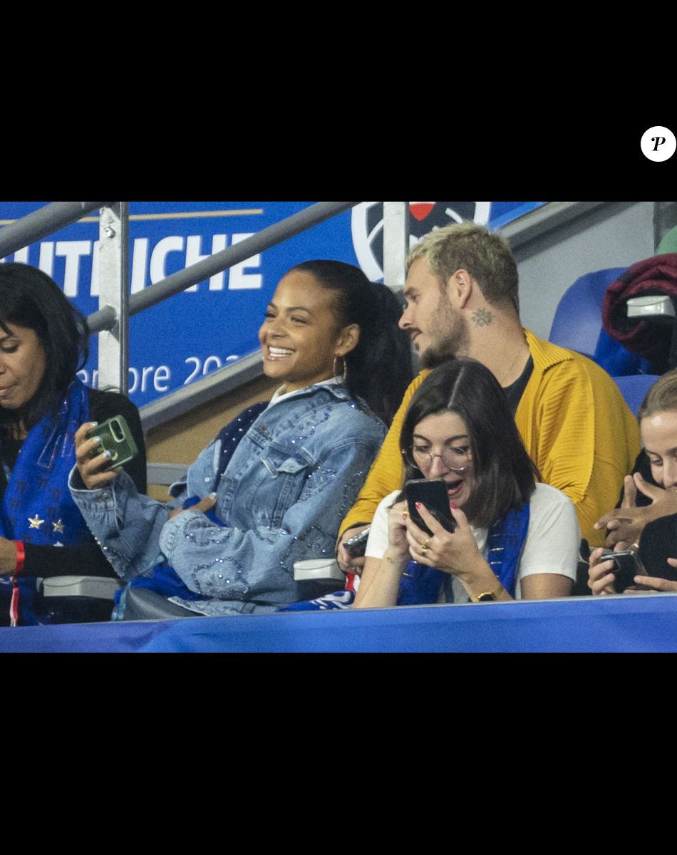 M. Pokora et sa femme Christina Milian - 5e et avant-dernière journée de la Ligue des nations entre la France et l'Autriche au Stade de France à Saint-Denis. Le 22 septembre 2022.