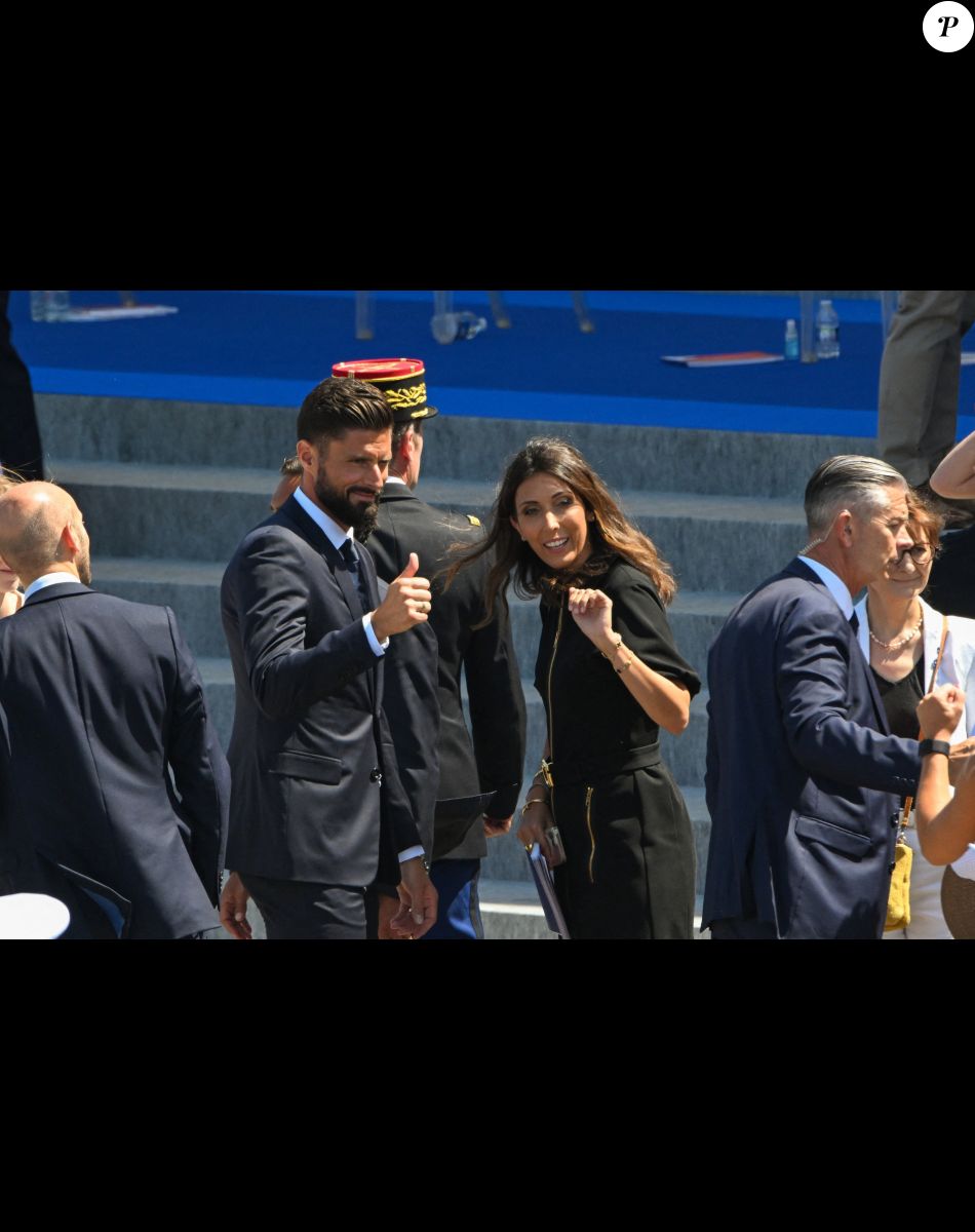 Olivier Giroud et sa femme Jennifer lors du défilé militaire du 14 juillet 2022 place de la Concorde à Paris. © Lionel Urman / Panoramic / Bestimage