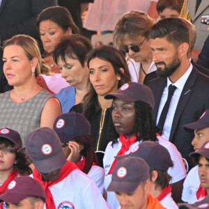 Olivier Giroud et sa femme Jennifer lors du défilé militaire du 14 juillet 2022 place de la Concorde à Paris. © Lionel Urman / Panoramic / Bestimage