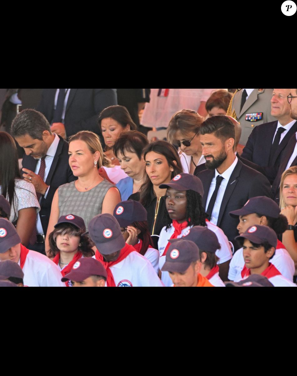 Olivier Giroud et sa femme Jennifer lors du défilé militaire du 14 juillet 2022 place de la Concorde à Paris. © Lionel Urman / Panoramic / Bestimage