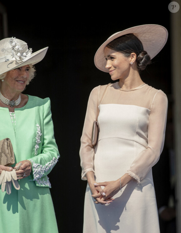 Camilla Parker Bowles, duchesse de Cornouailles, et Meghan Markle, duchesse de Sussex, lors de la garden party pour les 70 ans du prince Charles au palais de Buckingham à Londres. Le 22 mai 2018 