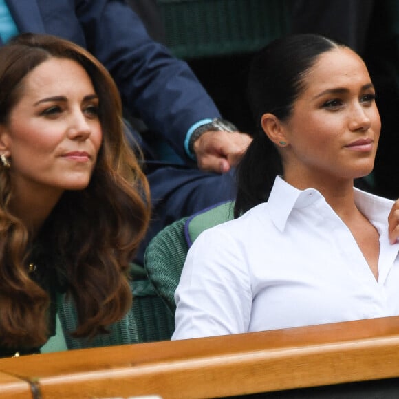 Archives - Catherine (Kate) Middleton, duchesse de Cambridge, Meghan Markle, duchesse de Sussex, sont dans les tribunes lors de la finale femme de Wimbledon "Serena Williams - Simona Halep (2/6 - 2/6) à Londres le 13 juillet 2019. © Chryslène Caillaud / Panoramic / Bestimage 