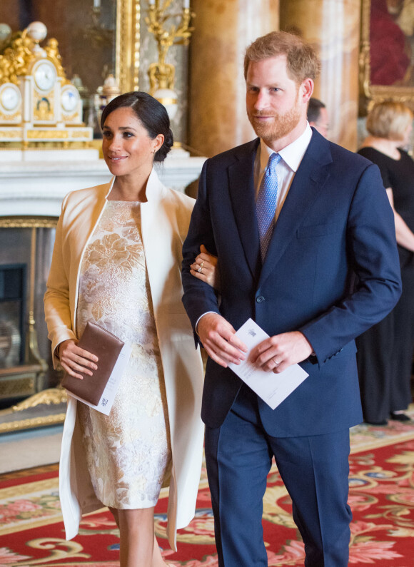 Le prince Harry, duc de Sussex, et Meghan Markle (enceinte), duchesse de Sussex - La famille royale d'Angleterre lors de la réception pour les 50 ans de l'investiture du prince de Galles au palais Buckingham à Londres. Le 5 mars 2019 