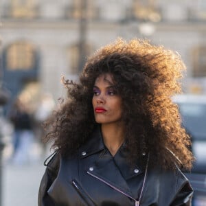 Exclusif -  Le mannequin français Tina Kunakey en body et perfecto adossé à une Ferrari 308 lors d'un shooting photo sur la place Vendôme en marge du prêt-à-porter automne-hiver 2023/2024 de la Fashion Week de Paris (PFW) , à Paris, France, le 2 mars 2023. © Da Silva-Perusseau/Bestimage 