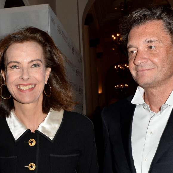 Carole Bouquet et son compagnon Philippe Sereys de Rothschild - Photocall de la 4ème édition du Gala " Planet Finance" au Carlton lors du 67ème festival international du film de Cannes. Le 15 mai 2014.