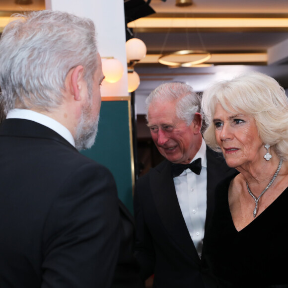 Le prince Charles, prince de Galles, et Camilla Parker Bowles, duchesse de Cornouailles, à la première de "1917" à Londres, le 4 décembre 2019. 