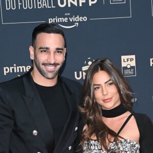 Adil Rami et sa compagne Léna Guillou - Photocall de la cérémonie des Trophées UNFP 2022 au Pavillon Gabriel à Paris le 15 mai 2022. © Coadic Guirec/Bestimage