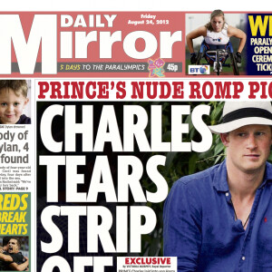 Archives - Le prince Harry en une du journal "Daily Mirror". Le prince Charles en colère après son fils, qui a fait la une du journal torse nu lors d'une fête. Le 24 août 2012