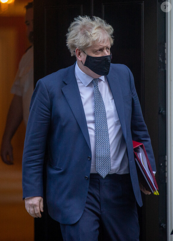 Le Premier ministre britannique Boris Johnson, au coeur d'un scandale, se rend au Parlement à Londres, le 12 janvier 2022.