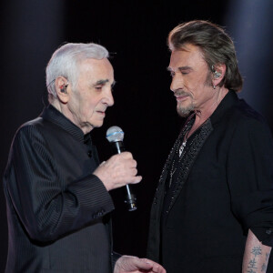 Johnny Hallyday et Charles Aznavour, pour La Fête de la Chanson Française, le 13 janvier 2013. © Dominique Jacovides / Bestimage