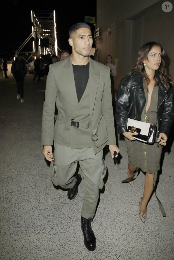 Achraf Hakimi et sa compagne Hiba Abouki - Arrivées au défilé de mode Femmes prêt-à-porter printemps-été 2022 "Balmain" à la Seine Musicale à Paris. Le 29 septembre 2021 © Christophe Aubert via Bestimage