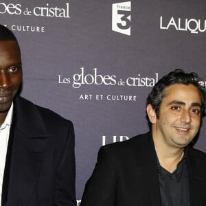 Philippe Pozzo di Borgo a inspiré Eric Toledano et Olivier Nakache pour produire le film "Intouchables" au cinéma.
François Cluzet, Omar Sy, Eric Toledano et Olivier Nakache aux Globes de Cristal, au Lido de Paris, en 2012
© Guillaume Gaffiot /Bestimage