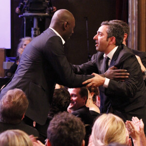 Omar Sy, Olivier Nakache, Eric Toledano à la 37ᵉ cérémonie des César au Théâtre du Châtelet à Paris, le 24 février 2012.
© Rindoff-Borde / Bestimage