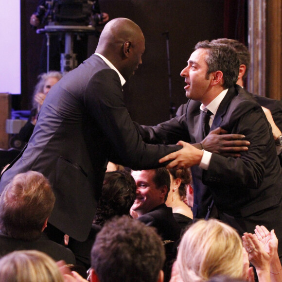 Omar Sy, Olivier Nakache, Eric Toledano à la 37ᵉ cérémonie des César au Théâtre du Châtelet à Paris, le 24 février 2012.
© Rindoff-Borde / Bestimage