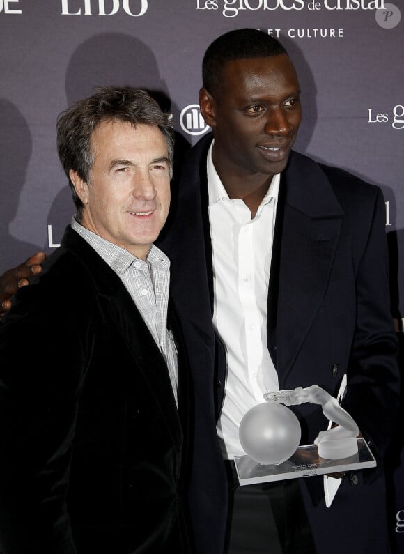 François Cluzet et Omar Sy aux Globes de Cristal, à Paris, en 2012.
© Guillaume Gaffiot /Bestimage